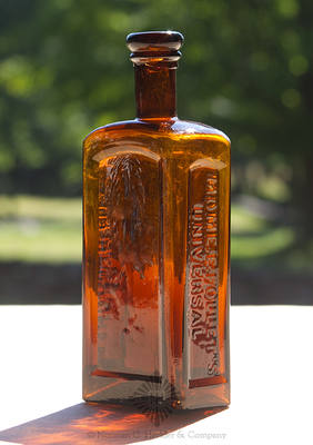 "Mdme. E. Follet's / Universal / Hair Restorer" Medicine Bottle