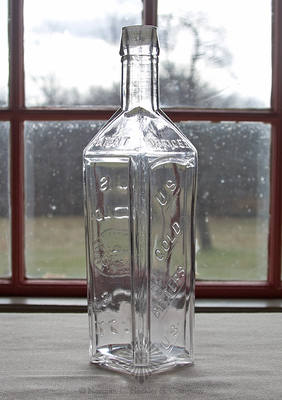 "U.S. / Gold / Bitters / U.S. / U.S / Gold / (US $20 Coin) / U.S / 1877 / Registered / In U.S / Patent / Office" Bitters Bottle, R/H #U-11