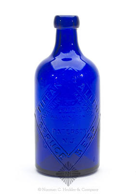 "Tiffany & Allen / Spruce Beer / Washington Market / Cor / Fair & / Washington St. / Paterson / N.J." - "Please / Return Bottle / Soon As / Empty" Beer Bottle