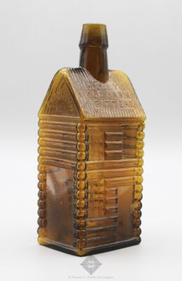 Kelly�s Old Cabin Figural Bitters Bottle