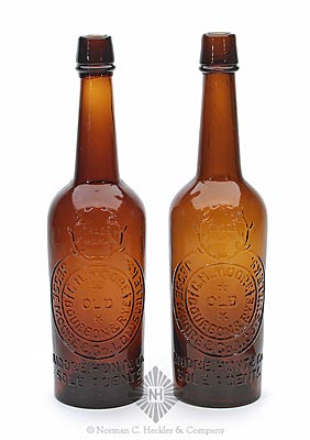 Two "Trade Mark (Within Antlers) / Jesse Moore Co. Louisville KY. / G.H. Moore / (Star) / Old / (Star) / Bourbon & Rye / Moore. Hunt & Co. / Sole Agents" Whiskey Bottles, JT #94